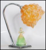 An early 20th Century 1930's Art Deco chrome table lamp light having a ceramic lady wearing a