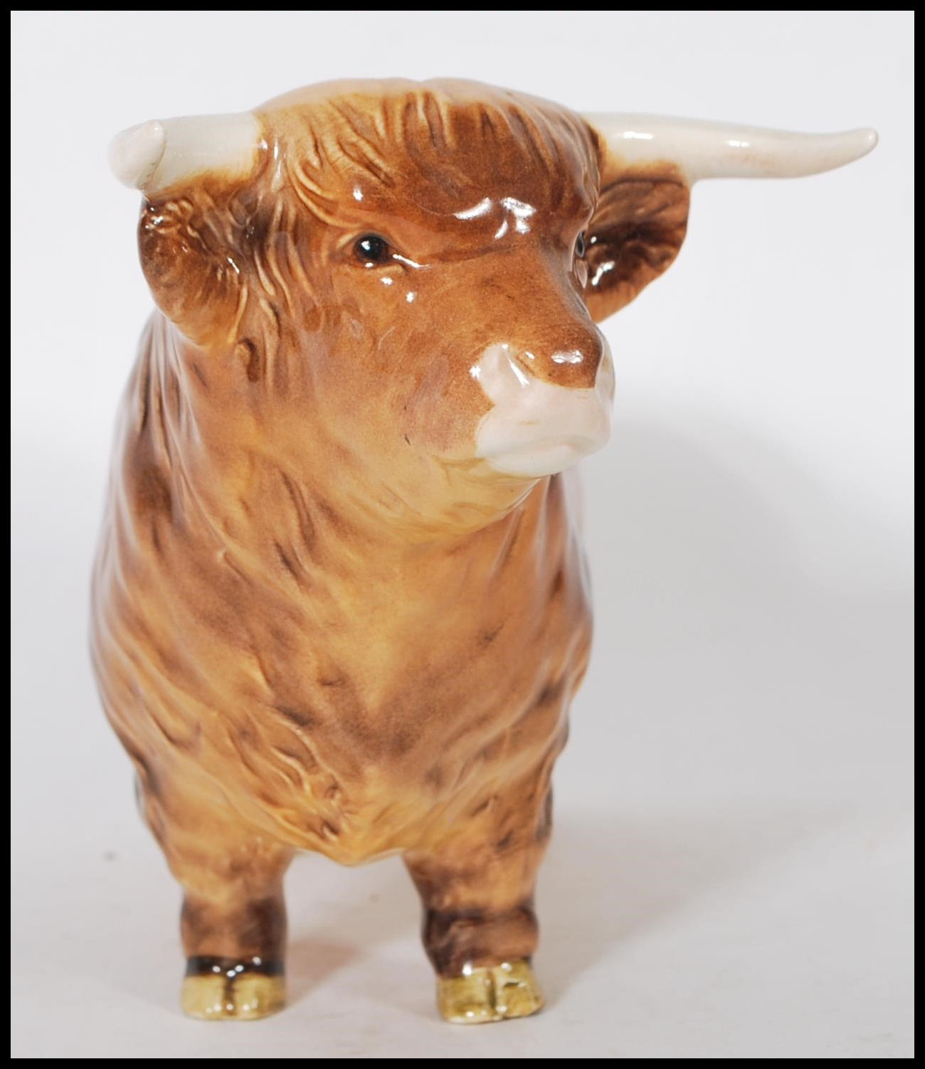 A Beswick ceramic figurine of a Highland cattle bull being stamped for Beswick, England to the foot. - Image 3 of 7