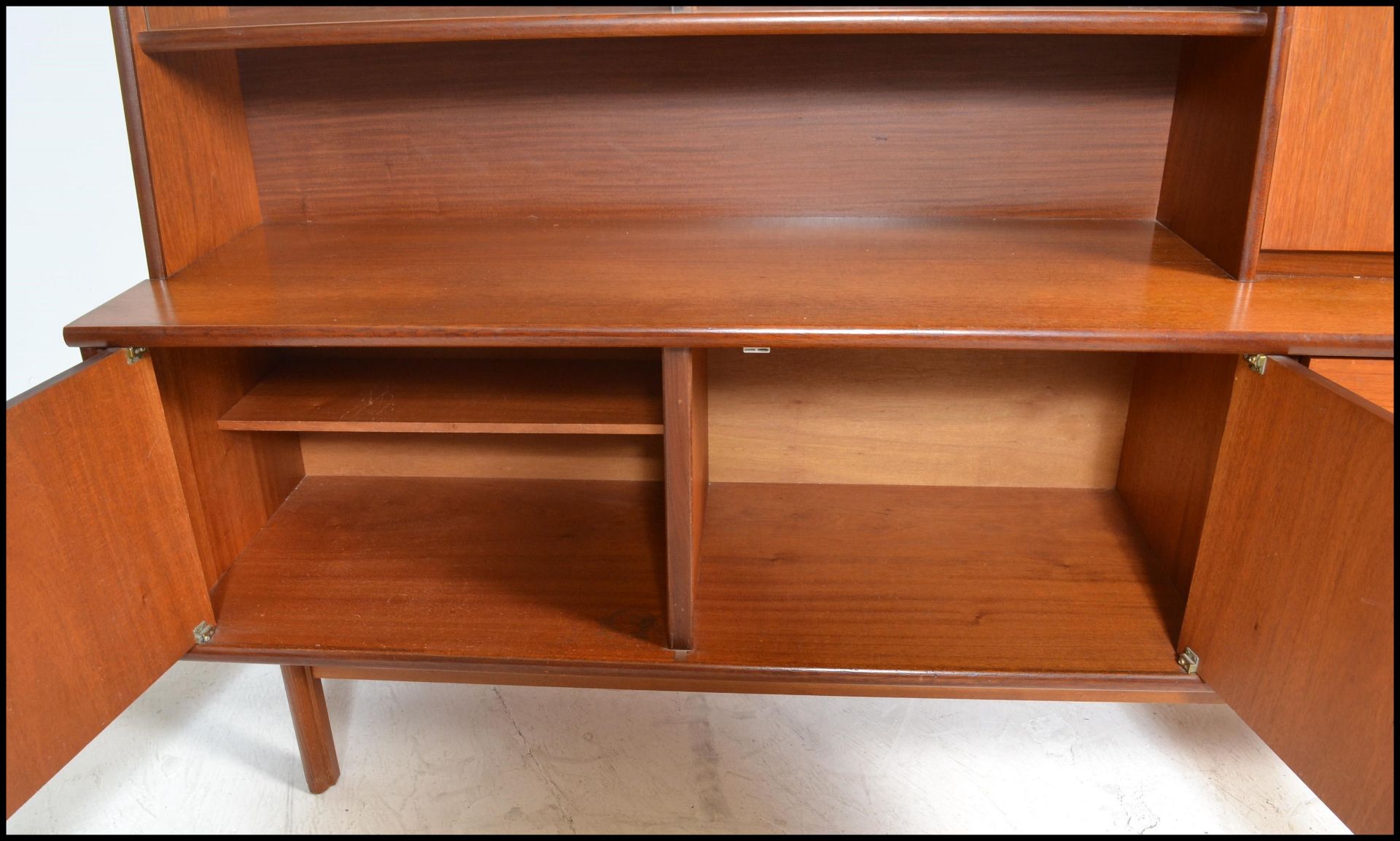 A retro 20th Century teak wood highboard sideboard credenza, being raised on square supports - Bild 5 aus 6