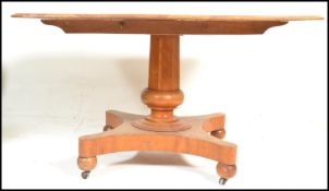 A late 19th Century high Victorian satin birch breakfast table with rectangular top and tilt
