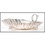 A 20th Century Mappin and Webb silver hallmarked trinket dish in the form of a leaf with shaped