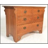 A late Victorian 19th century Arts & Crafts oak chest of drawers. Raised on bracket feet with a bank
