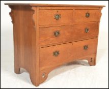 A late Victorian 19th century Arts & Crafts oak chest of drawers. Raised on bracket feet with a bank
