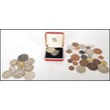 A collection of coins dating from the early 19th Century to include a George IV 1821 crown with