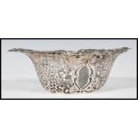 A Canadian sterling silver bonbon dish having embossed scroll and foliate decoration with pierced