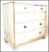 A Victorian 19th century shabby chic painted 2 over 3 chest of drawers raised on bun feet with short