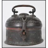 A 19th Century Indian beaten metal Paan Daan Betel / spice nut caddy box of round form having a
