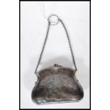 A early 20th Century silver hallmarked ladies coin purse having ball clasp atop with foliate