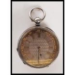 An early 20th Century silver pocket watch having a silvered engine turned dial with gilt roman