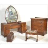 A believed Woods Bros mid century oak Jacobean revival dressing table, stool and chest of drawers.