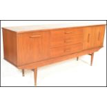 A mid 20th Century 1960's teak wood Danish style sideboard having twin cupboard doors to the right