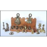 A collection of unusual brass ornamental figures to include mythical creatures, goblins, pixies