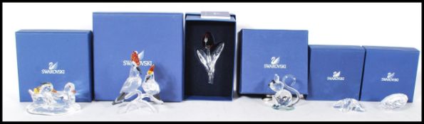 A selection of Swarovski cut glass figurines to include a starfish, sea shell, mandarin ducks,