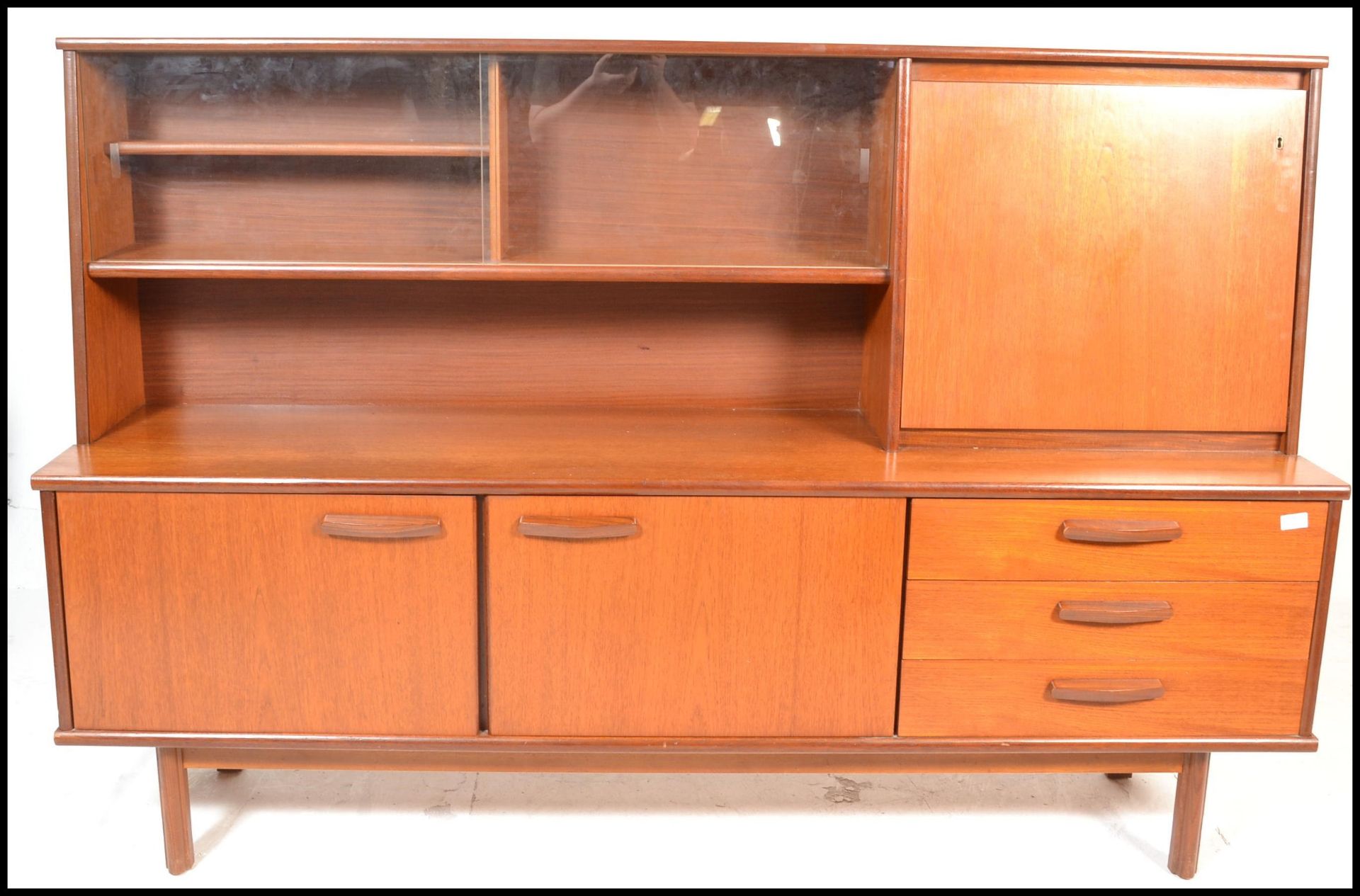 A retro 20th Century teak wood highboard sideboard credenza, being raised on square supports - Bild 2 aus 6