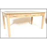 A mid 20th Century school / air ministry desk,constructed from beech wood, flared top with inset