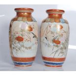 A pair of 19th Century polychrome and gilt  Japanese Kutani vases decorated with panels depicting