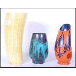 A group of three retro mid 20th Century studio pottery vases to include a What's Vincent Cadeaux