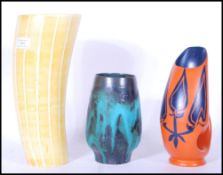 A group of three retro mid 20th Century studio pottery vases to include a What's Vincent Cadeaux