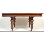 A good Victorian 19th century solid oak 3 leaf extending dining table. Raised on ring turned