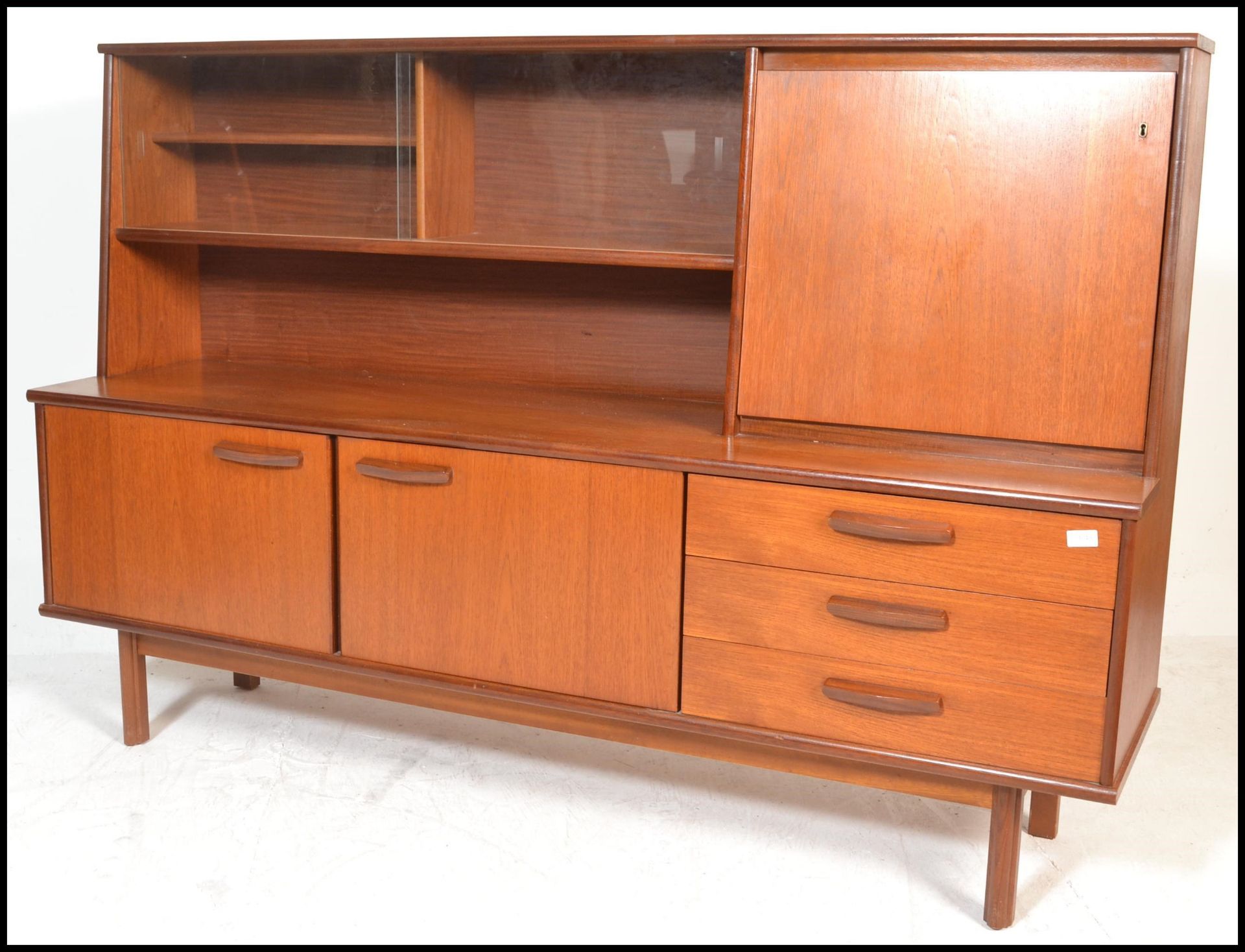 A retro 20th Century teak wood highboard sideboard credenza, being raised on square supports - Bild 3 aus 6