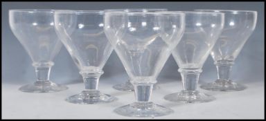 A group of six 19th Century Georgian rummer glasses having tapering bowls with capstan stems