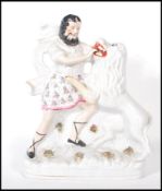 A 19th Century Staffordshire pottery flat back figure group depicting Sampson and the lion. Measures