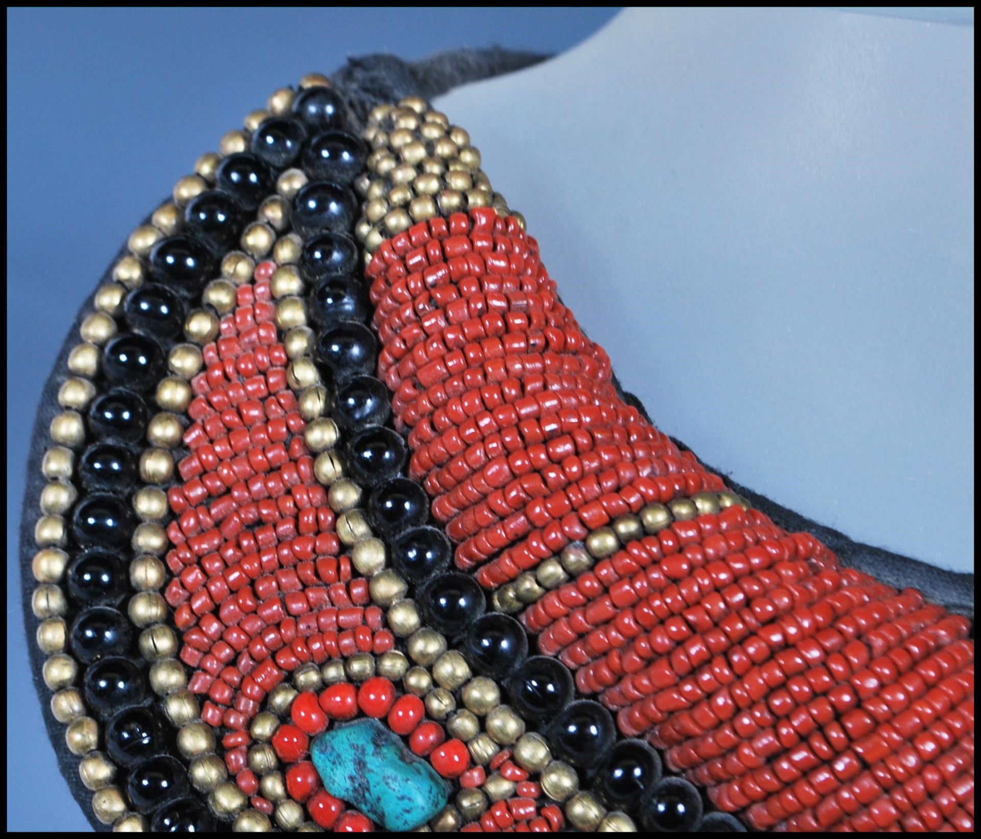 A 20th Century Tibetan tribal collar necklace constructed from a fabric panel stitched with red - Image 8 of 17