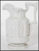 A Victorian Charles Meigh 19th Century Gothic salt glazed jug ' The Minster Jug ', circa 1840 having