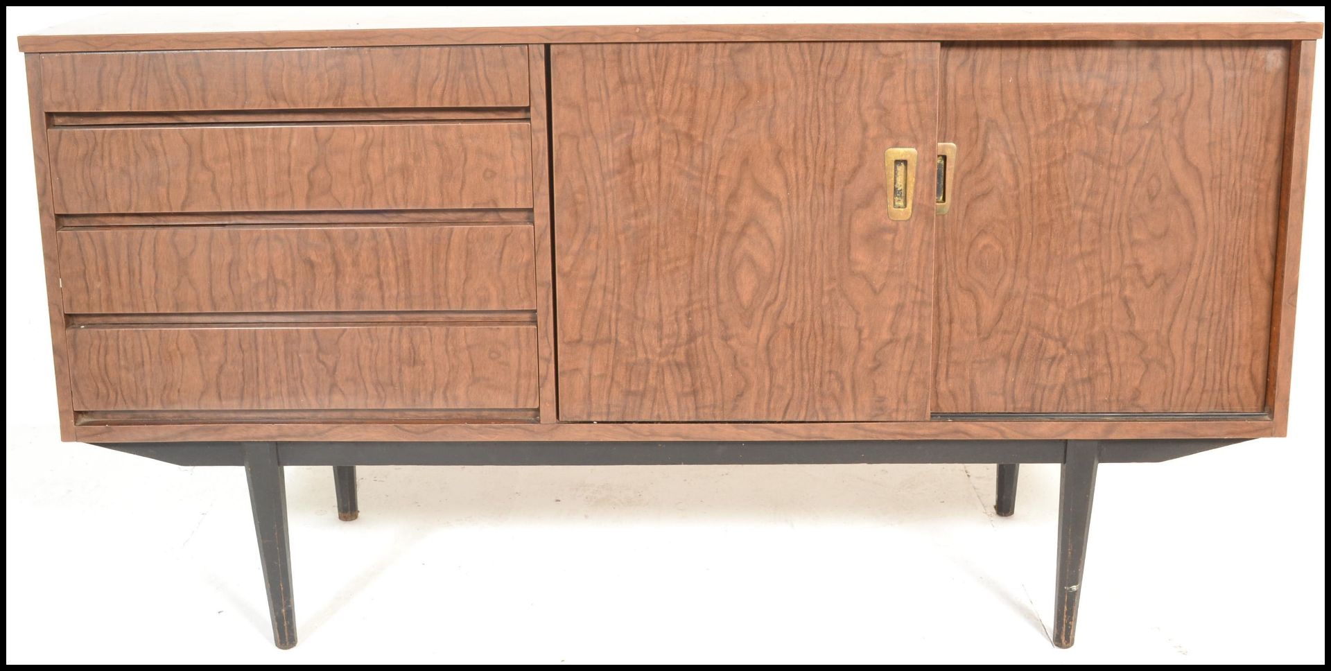 A mid century melamine sideboard credenza being raised on tapering legs with angled wide body - Image 3 of 7