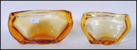 Two vintage retro amber glass vases of organic ovular form in the manner of Miloslav Klinger for