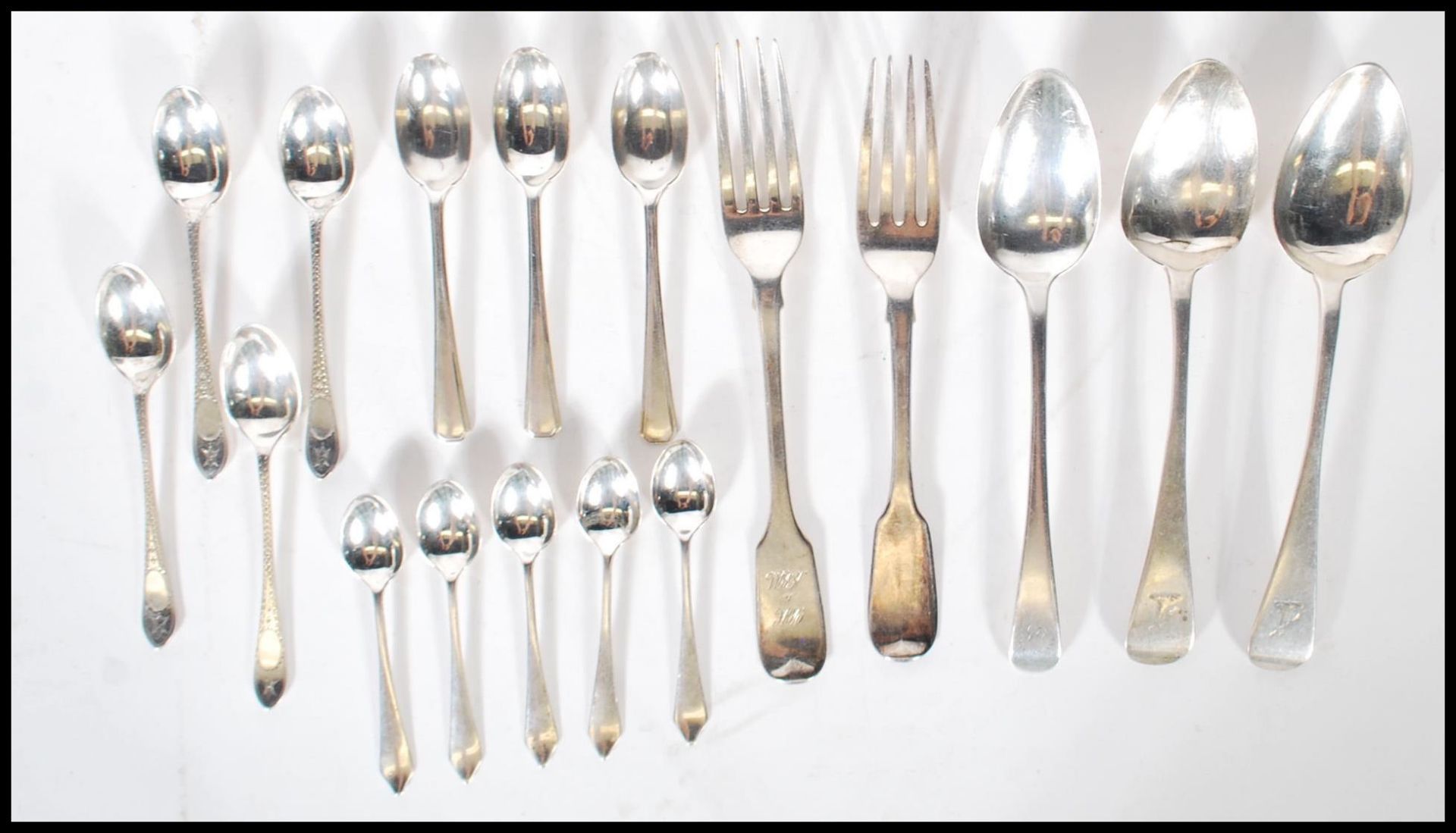 A collection of silver teaspoons all being hallmarked to include a set of Sheffield hallmarked