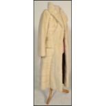 A vintage 20th Century well tailored ladies full length white mink coat bearing a label for