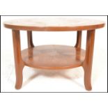 A mid century Danish influence teak wood circular astro coffee table in the manner of G-Plan