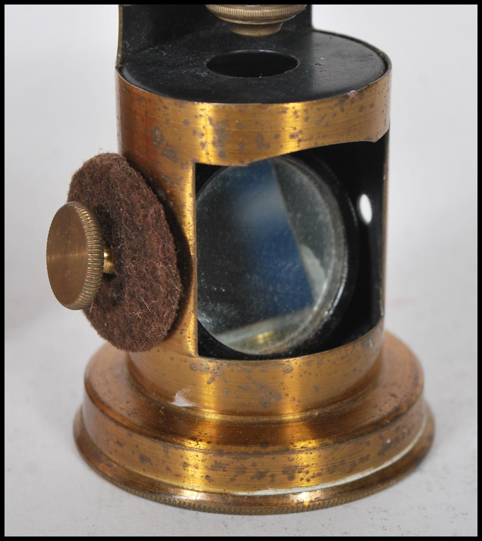 A late 19th Century brass students pocket cased microscope, adjuster to side fitted in a hinged - Image 3 of 7
