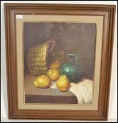 A 20th Century Italian oil on canvas painting depicting Sicilian lemons with a green glazed
