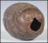 An early 19th Century Georgian bugbear carved coconut of typical form, carved as a mythical creature
