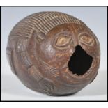 An early 19th Century Georgian bugbear carved coconut of typical form, carved as a mythical creature