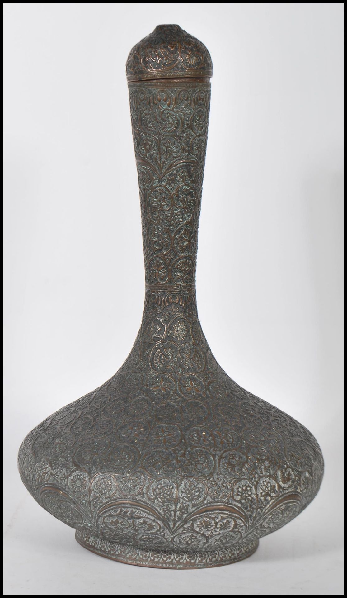 A early to mid 20th Century Middle Eastern / Islamic lidded copper water pourer / vase of bulbous