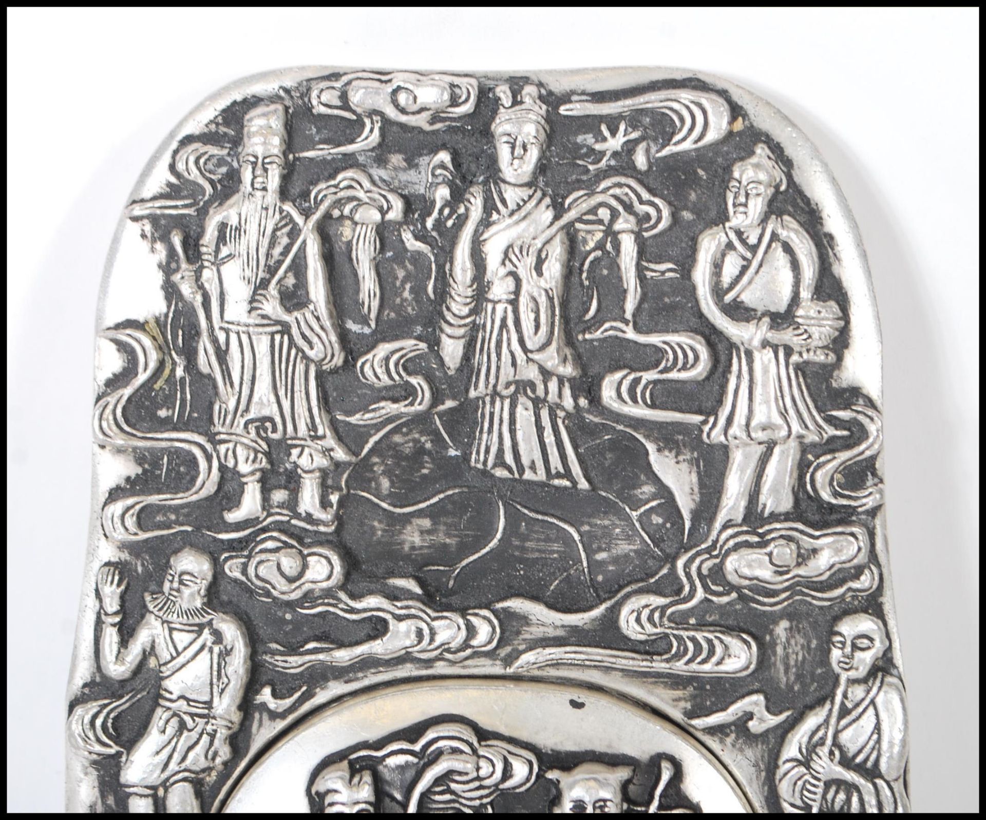 A Chinese white silver inkwell of ingot form, cast in relief with elders and Crane's central - Image 2 of 6