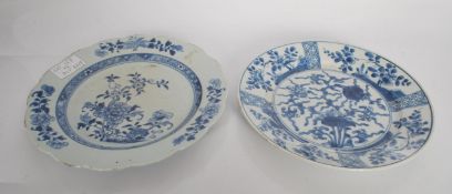 A pair of 18th Century Chinese blue and white glazed plates, scalloped rims with central floral