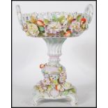 A 19th century / early 20th century Sitzendorf floral encrusted centrepiece tazza. The base with