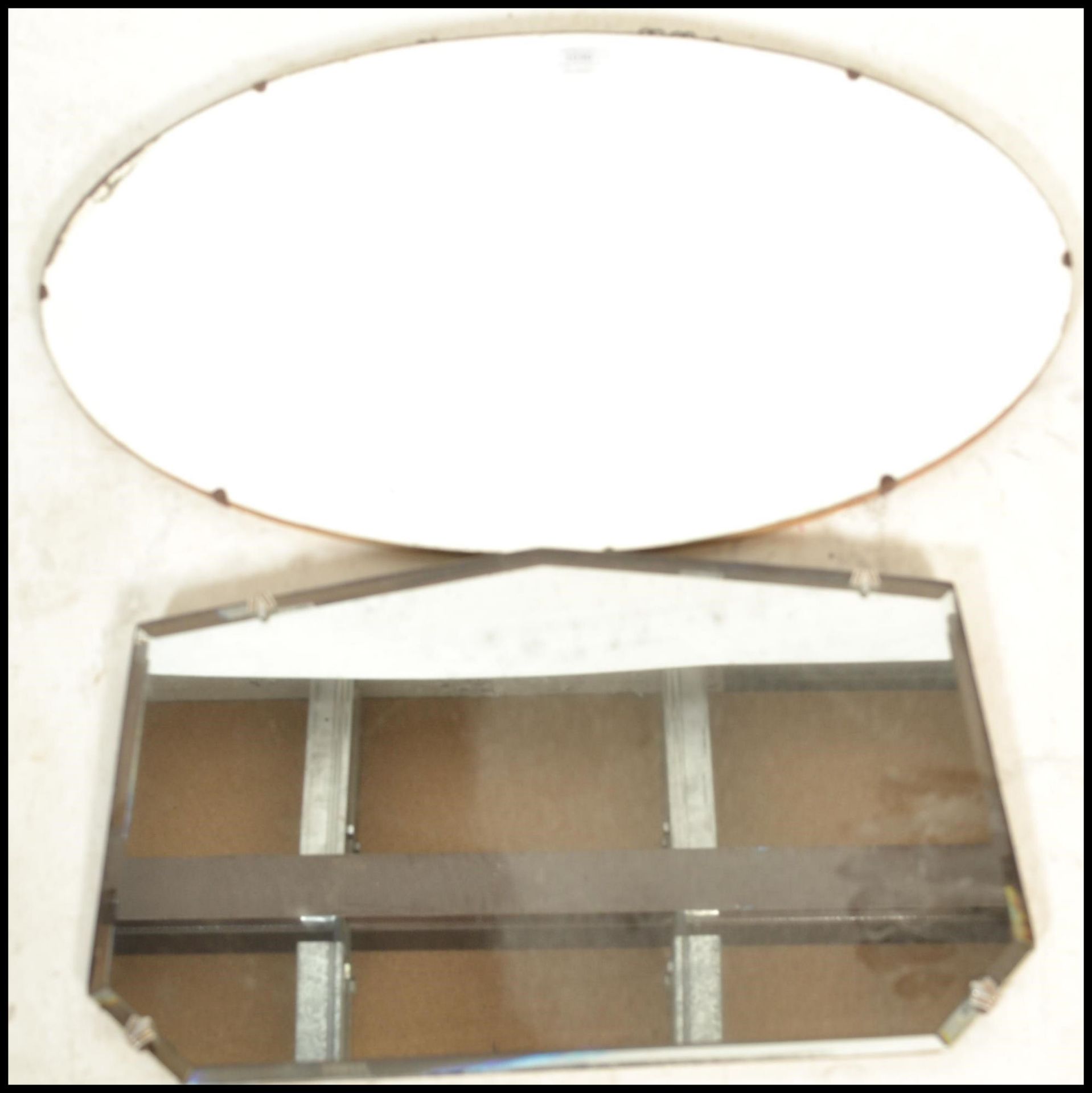 Two vintage mid 20th Century frameless mirrors to include an oval shaped mirror with bevelled - Bild 2 aus 6