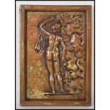 A 20th Century cast bronze wall plaque having an embossed design depicting a classical figure of