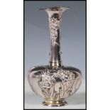 A Chinese silver vase of small proportions having a bulbous body with tapering trumpet neck
