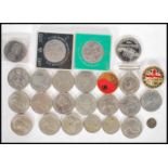 A collection of coinage to include a quantity crowns, World War two medal, two commemorative war