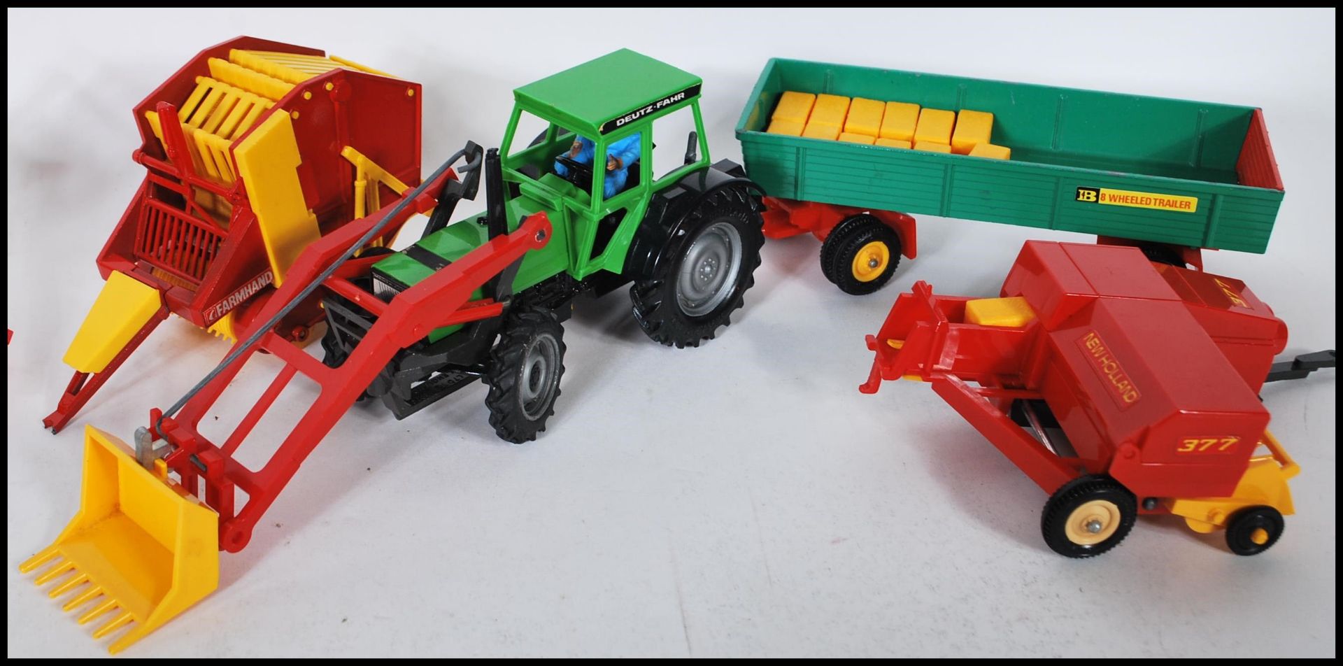 A COLLECTION OF BRITAINS FIRST FARMYARD VEHICLES AND ACCESSORIES. - Bild 2 aus 5