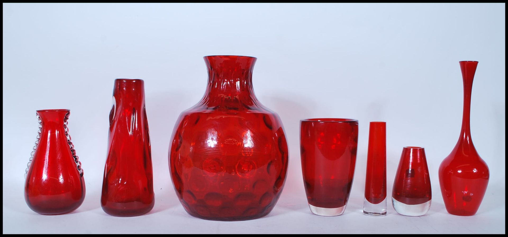 A selection of 20th Century vintage retro red ruby studio glass vases to include a Borsk olive style