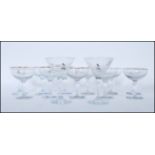 A collection of vintage Babycham advertising glasses to include three different styles to include
