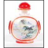 A late 19th Century Chinese glass perfume scent bottle of small proportions having the interior hand