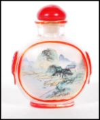 A late 19th Century Chinese glass perfume scent bottle of small proportions having the interior hand